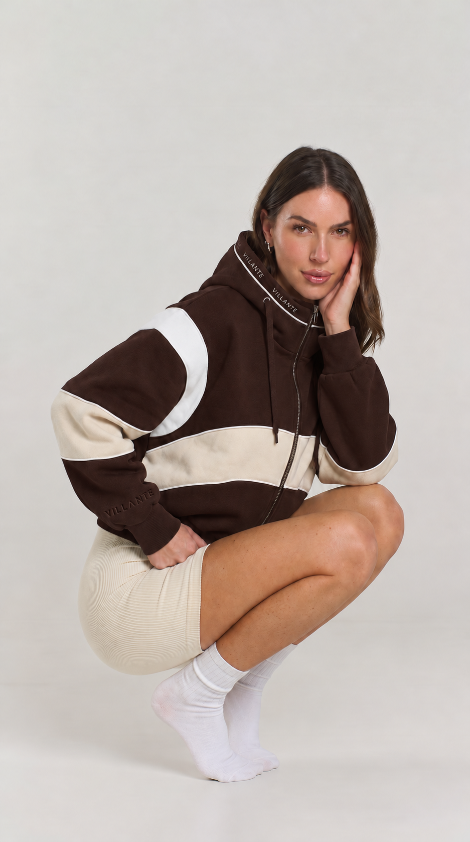 Woman wearing The Everyday Zip in Mocha
